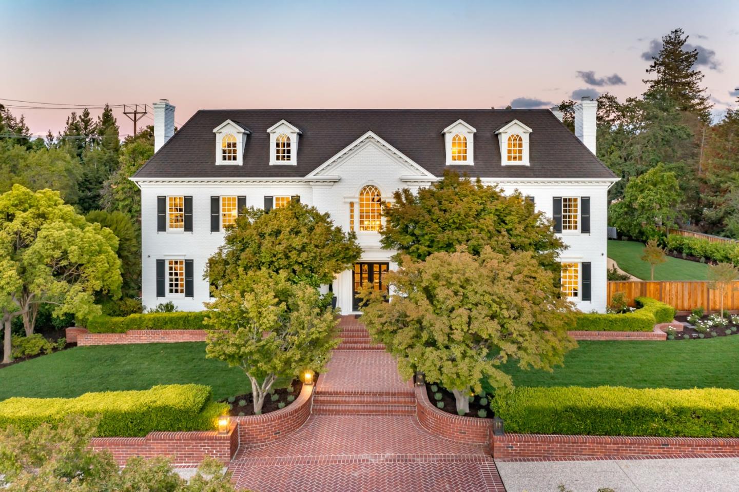 Recently renovated American Colonial masterpiece on 1.14 AC in Atherton. Offering 7 bedrooms, 8.5 baths, and 11,660 sf of living space. Hardwood floors, marble finishes, fine millwork, and high ceilings craft a luxurious ambiance through all 4 levels of the estate. Highlights incl. 4 fireplaces, expansive formal rooms, gourmet kitchen w/new top appliances from Wolf, Sub-Zero, & Viking, handsome office. Incredible master suite w/2 walk-in closets, 2 bathrooms, and balcony access. Theater w/projection room, fitness center w/sauna, wine cellar w/tasting area. Newly landscaped backyard w/new pool, outdoor kitchen, fire pit. Multiple rooms open to grounds for indoor/outdoor living. 5-car garage, gated motor court for extended parking. Moments to downtown Menlo Park & Palo Alto, convenient to Stanford, Menlo Circus Club, Sand Hill Road. Top ranked public & private schools incl. Las Lomitas Elementary and Sacred Heart are minutes away.