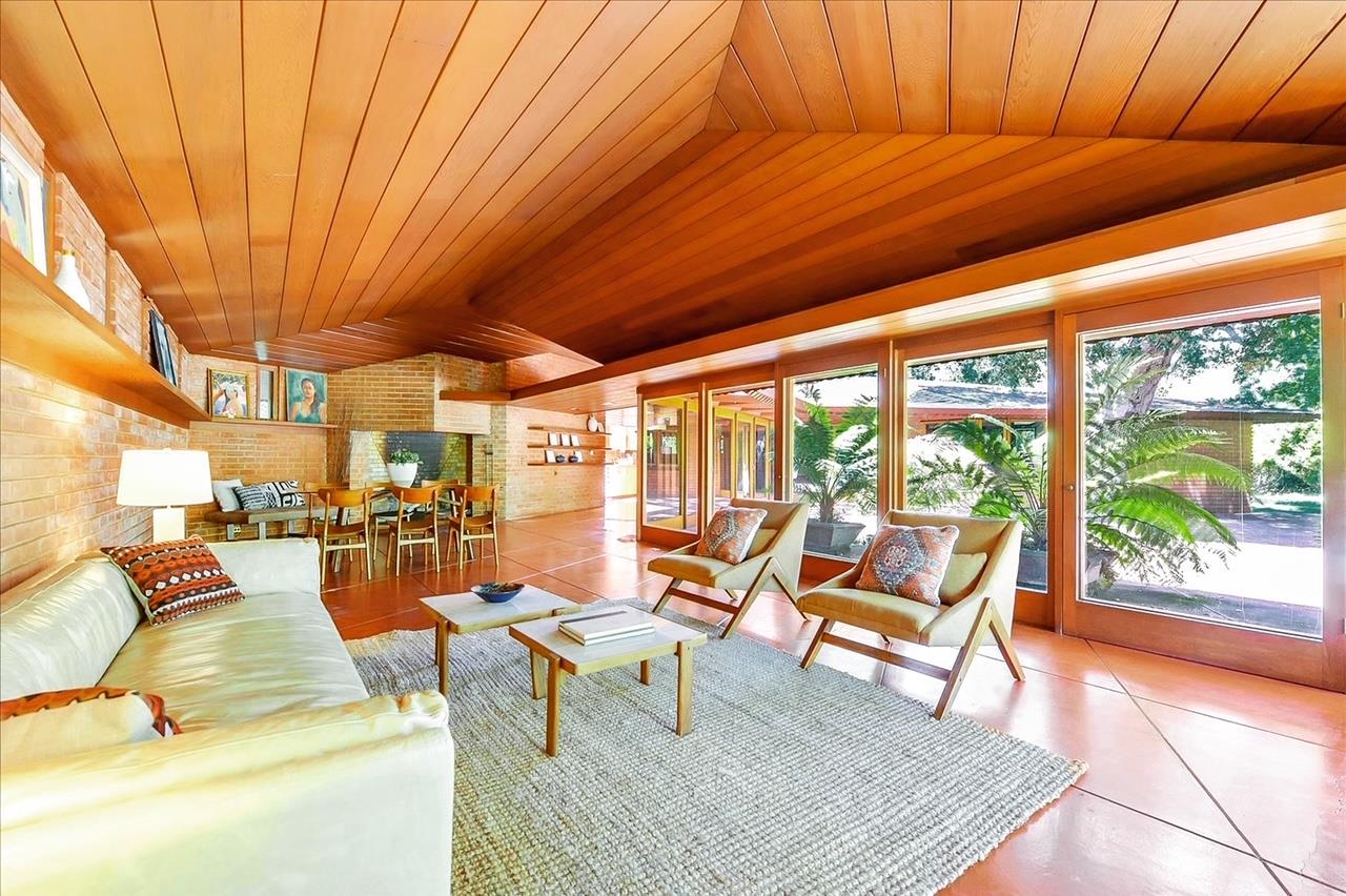 Designed by the world-renowned architect, Frank Lloyd Wright, this all-original Usonian style home sits tucked away on a quiet Atherton street. This home is not covered by any historic designation. Traditional of Wright's designs, the brick structure has a diamond shape layout with two parallel wings that are connected at an angle by the kitchen and dining area. Philippine mahogany walls and original built-in shelving add to the charm of this special home. The dining area and living room share a large brick fireplace and walls of glass that overlook the terrace and private grounds. With landscape designed by Thomas Church, this magical home is surrounded by mature whimsical oak trees. Completed in 1952 by Green and Green Construction, this living piece of history continues to delight modernists worldwide.