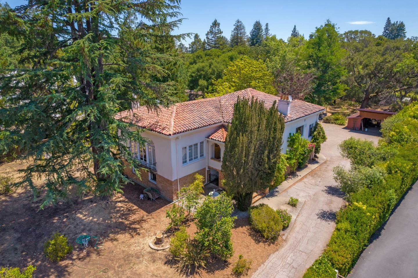 Located on one of West Atherton's most prestigious streets, this one-of-a-kind fine two-story Spanish inspired estate is situated on a large level lot with an established fruit orchard.  Almendral Avenue is one of the few remaining quiet streets in Atherton.   The main residence features 5 spacious bedrooms and 2.5 bathrooms with intricate details throughout. Beyond the main home lies a separate 1 bed/1 bath cottage with a kitchen, perfect for extended family, guests or additional office space.  167 Almendral Avenue is secluded yet conveniently located just minutes away from The Circus Club, Stanford University, renowned private schools, Sand Hill Road, and some of the most successful high-tech companies (Facebook, Google, and Apple). Atherton's mid-peninsula location is also centrally located between San Francisco and San Jose International Airports.  Because of its privacy, beauty, and location, this represents a rare opportunity to own one of the finest properties in Atherton.