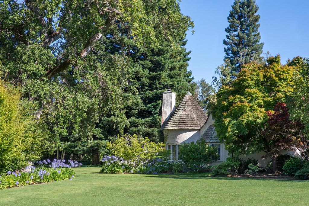 Outstanding opportunity to renovate and/or build in the heart of central Atherton just blocks to Menlo Circus Club. Deep 2-acre lot  (approx. 205.14 x ~424.79)  with vast sun-swept land.  The existing Tudor residence is 3-bedroom and 3-bath (down to the studs) plus a 1-bedroom guest house. Complete privacy from the street beyond tall hedges. Well for irrigation. Located in the #1 ZIP code per Forbes midway between SF & Silicon Valley.