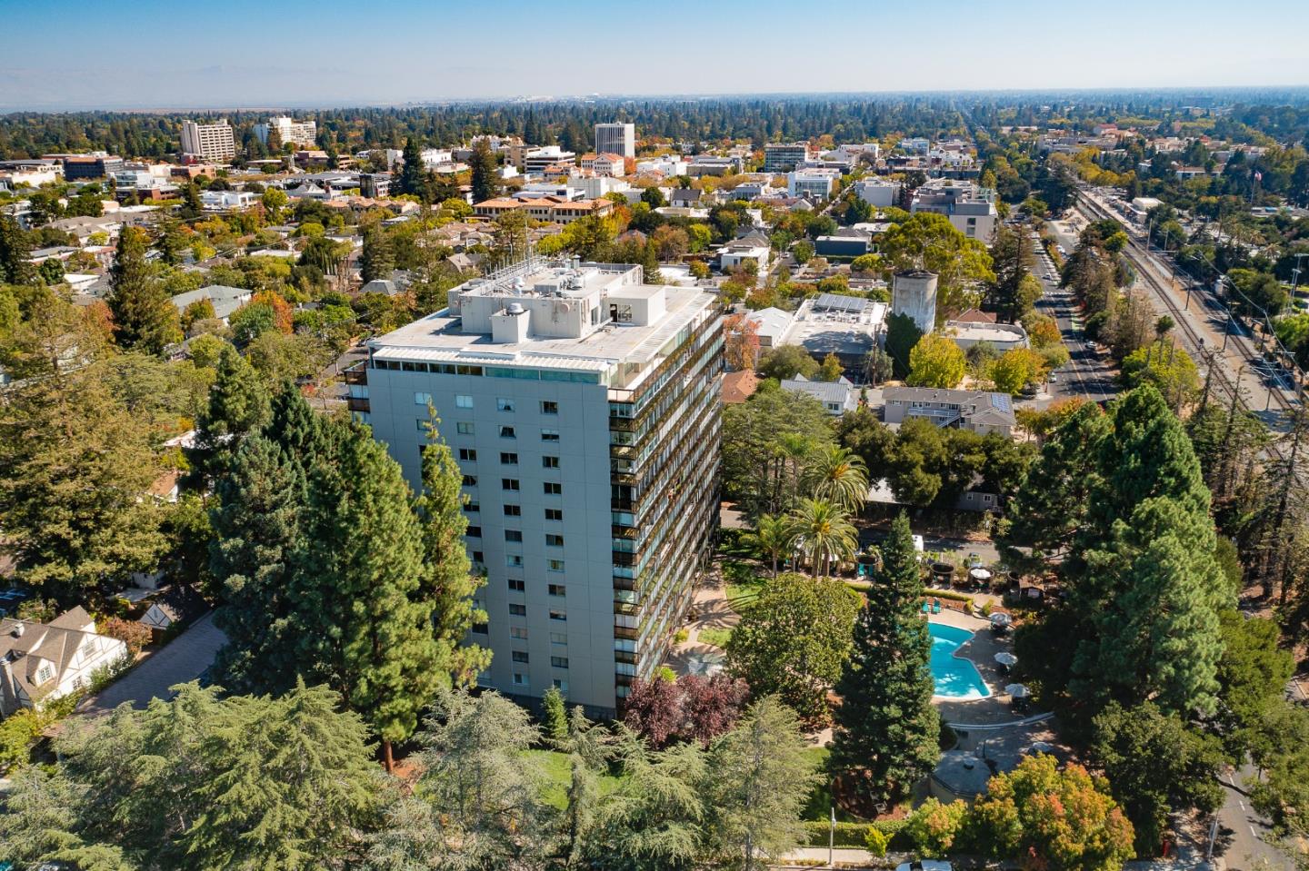 Welcome to The Palo Alto, a luxury condominium complex with 24/7 security, located within walking distance to Stanford University and Medical Center, University Avenue, and the Stanford Shopping Center, a premier outdoor mall. Spacious and sophisticated, this 1032 sq ft 1BR/1BA condo offers a quiet space to live, work, and enjoy all that Palo Alto has to offer. It has been completely remodeled with quality finishes including granite kitchen countertops, custom cabinetry, and hardwood flooring throughout.  The bathroom has an added built-in storage area, marble countertops, and stone tiles. There's a dining alcove just off the kitchen and a lovely office space adjacent to the inviting living room.  A lanai-like area off the bedroom provides a space for relaxing at the end of a long work day. Amenities include a sparkling swimming pool, parking, gym, additional storage closet, club house, study/library room, and more.